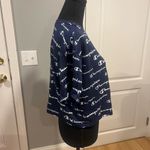 Champion logo all over graphic crop top Photo 2