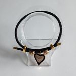 Adjustable steel wire bracelet with charm. Gold Photo 4