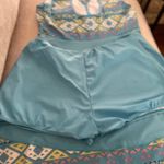 Blooming  Jelly Stylish blue tankini set with geometric patterns. Features a tie-front design. Photo 9