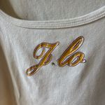 Jennifer Lopez White Tee with Gold Accents Photo 1