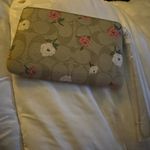 Coach  Corner Zip Wristlet in Signature Canvas with Heart Floral Print. Photo 1