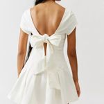 Urban Outfitters NWT UO Bryan Bow-Back Pleated Drop Waist White Denim Mini Dress Photo 2