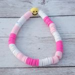 Pink & White Stretch Bracelet with a Smiley Face Photo 0