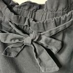 Kendall + Kylie Kendell and Kylie black paper bag pants. Cargo pockets in size large. Photo 2