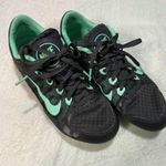 Nike Black and Mint Green Spikes Photo 0