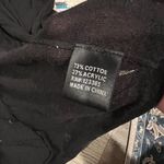 Isabella Rodriguez  small black cardigcan top Photo 5