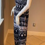 New Women’s dark Navy Blue jumpsuit size L/XL for size 14 New with tags Straps are adjustable Stretchy with front pockets Photo 5