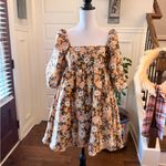 Storia  NWOT Warm Multi-Color Floral Baby Doll Mini Dress Photo 1