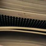 Kate Spade red wallet. Some minor staining on sides. Photo 1