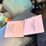 Juicy Couture new tags. I cannot open up the inside or it will cut the tag off. Photo 5