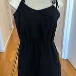 BCBGeneration Black Romper with Pockets and Lace Trim Photo 1