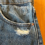 ZARA denim mini skirt, size 11/12. It is slightly distressed with a raw hem. Photo 2