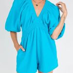 Vestique Romper Photo 1