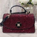 Kate Spade New York Odette Glitter Mini Top Handle Bag in Black/Cherry Photo 0