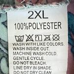 Boutique NWOT--WOMENS SIZE 2X-PINK AND GREEN BABYDOLL TOP Gorgeous pink and green babydoll top, has stretch tie at neck, short sleeves, 100% polyester, excellent condition  Measurements: Bust: armpit to armpit 23 inches  Length: shoulder seam to bottom 27 inches  Photo 7