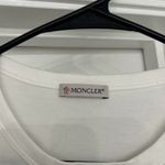  Tee Only worn once, looks and feels brand new. All tags still attached. Elevate your casual wardrobe with this Moncler white t-shirt. Photo 2