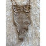SKIMS Seamless Sculpt Strapless Thong Bodysuit Clay
Size Small Photo 4