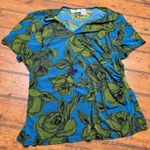 Kathy Ireland  green roses flowers and blue blouse with‎ pin Photo 0