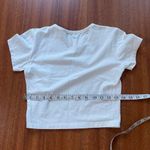Brandy Melville white cherub graphic crop top Photo 3