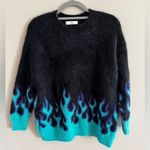 Adika Black and Blue Flame Sweater Photo 0