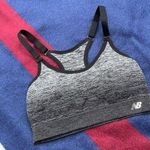 New Balance  Grey and black sports bra
Fits like a women’s size XS/S Photo 0