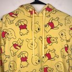Disney Women’s Winnie the Pooh Bear Cropped Yellow Drawstring Hoodie Sweatshirt Photo 1