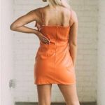 Glam  orange Leather Bow Dress size small Photo 1
