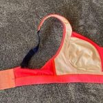Lululemon  bright orange/navy blue sports‎ bra ( 32C ) Photo 6