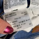 Levi's 721 Ripped Knee High Rise Skinny Jeans Photo 6