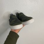 Rothy's The Original Slip On Sneaker in an olive green and navy camo pattern Photo 2