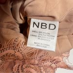 NBD  Revolve Secrets Revealed Lace
Asymmetrical Romper in Dusty Rose Sz XS Photo 10