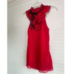 B. Wear  Red Ruffle Blouse Photo 1