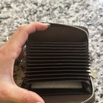 NWT credit card holder wallet. Comes with multiple pockets and chain. Pink Photo 2