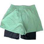 We Wore What  layered green black spandex running shorts Photo 4