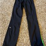 Lululemon Athletics Crops Black Leggings with green stripe Size 2 excellent cond Photo 2