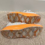 Nobull Journey running shoe in white with an orange midsole Photo 4