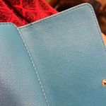 Michael Kors , and fair used condition billfold. I took pictures of the callouts​ Photo 6