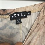 Motel  sheer cover up Brown and Black Animal Print Flare Pants Photo 4