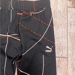 Puma  Black Leggings with Red and White Accents Photo 1