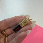 YSL Yves Saint Laurent Gold and Black Charm with Red Detail Photo 3