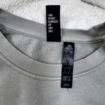Adidas Women’s Medium  sweatshirt. Light green/gray. Striped sleeves. Photo 2
