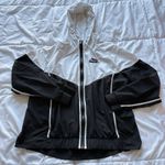 Nike  Womens Size Large Windbreaker Sportswear Windrunner Black White Hooded Photo 0