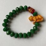 Jade stone bracelet with golden tiger and Ruby red glass bead with inscription Green Photo 1