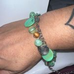 Silver Tone with Green Shimmer Shell Discs Photo 0