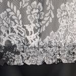 B. Wear black and white lace halter tank Photo 3