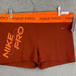 Nike NEW  Pro Dri Fit Mid-Rise Shorts Women XXL Orange 3in GRX Athletic Training Photo 0