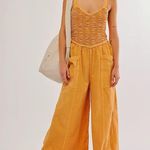 Free People forever and always Yellow Melo Pearl jumpsuit size xl Photo 0