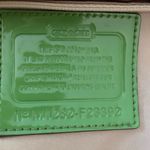 Coach  hobo-style crossbody purse, beige signature with green leather trim. Photo 9