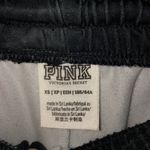 PINK - Victoria's Secret Victoria's Secret PINK camo track pants sweatpants size XS Black camo sweatpants Photo 4