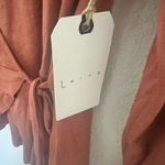 Leith Wrap Surplice Long Sleeve V-Neck Top in Cedar Coral Size Large Photo 6